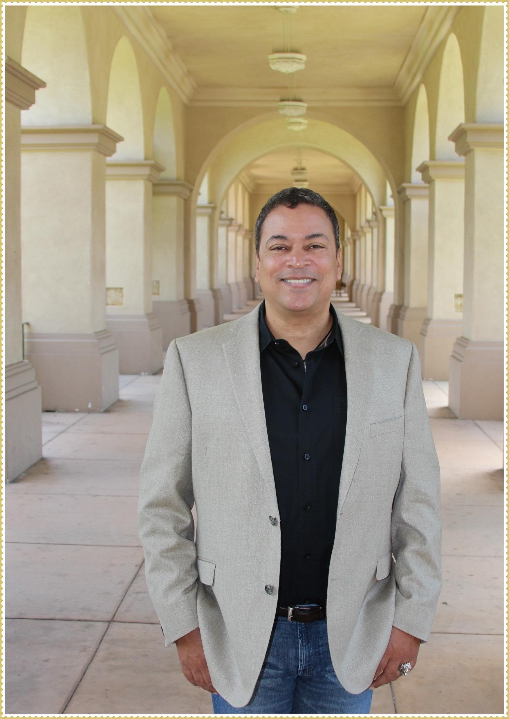 Coach sitting and smiling